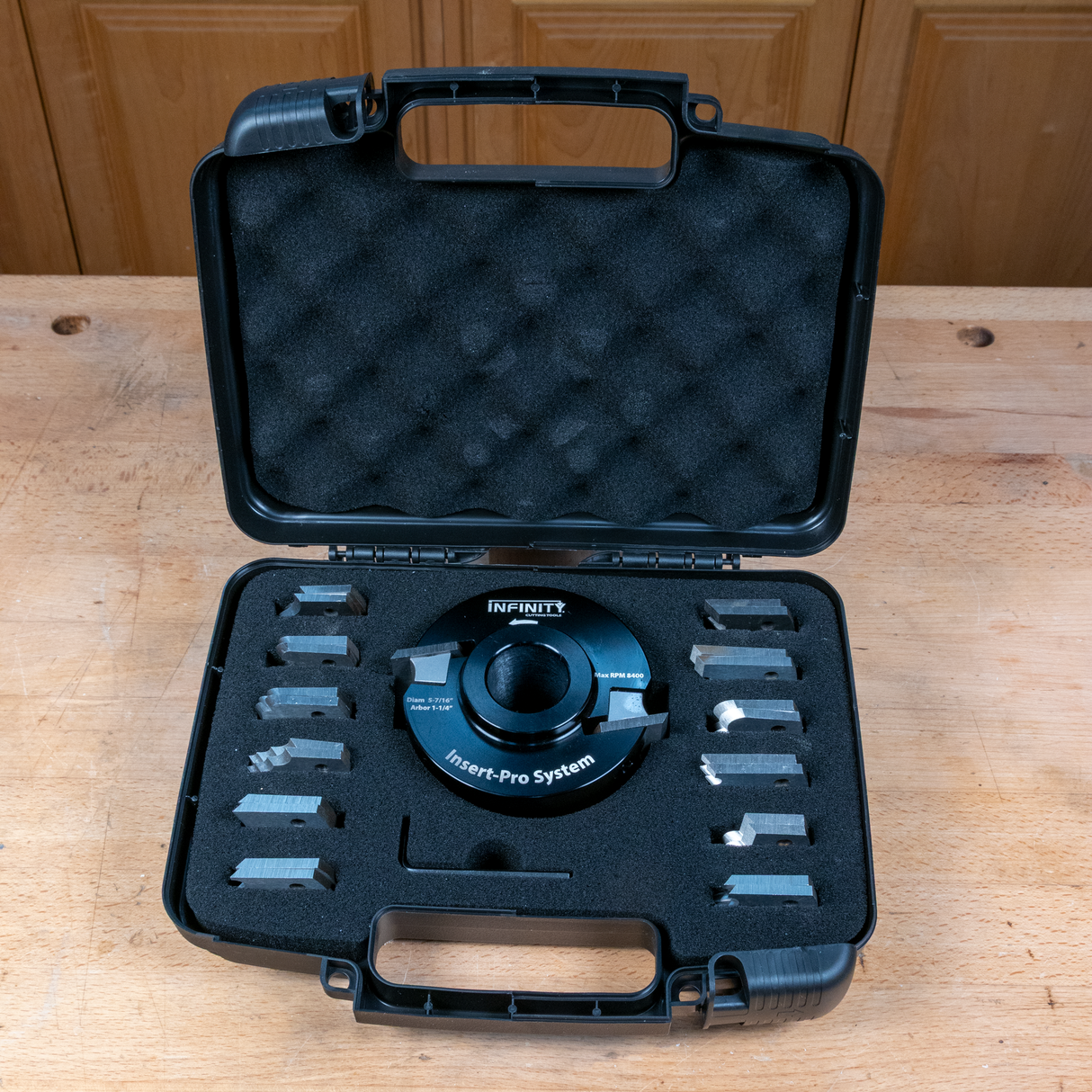 Insert-Pro router bit system with multiple steel cutting inserts in a foam-lined carrying case