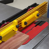 Table saw with featherboard, fence, and wood piece for precise woodworking cuts