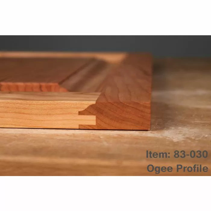 Wooden cabinet door corner with ogee profile and joinery details on workbench