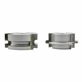 Two silver woodworking router bit cutter heads for shaping and joining wood pieces