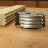 Display cutter head for woodworking with matching grooved wood profile on a workbench