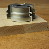 Display cutter head with tongue and groove finished profile on hardwood, woodworking tool closeup
