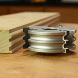 Display cutter tool with detailed molding profile and sample wood on workbench