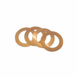 Set of four brass shims for woodworking tool alignment on white background