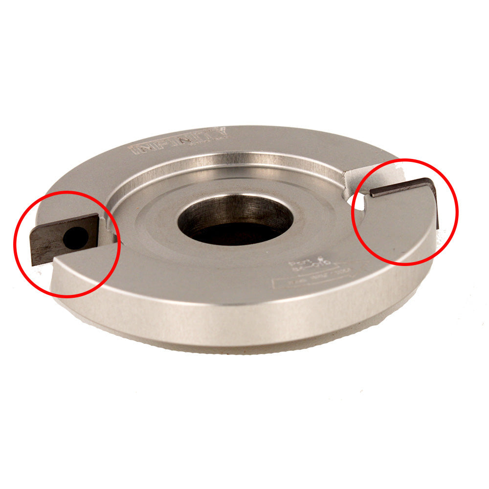 Close-up of metal woodworking cutter head with carbide inserts, highlighted with red circles.