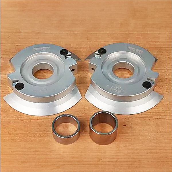 Carbide-tipped shaper cutter heads and bushings for woodworking on a wooden surface
