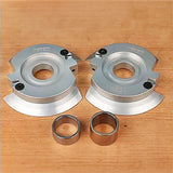 Carbide-tipped shaper cutter heads and bushings for woodworking on a wooden surface