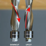 Close-up of downcut and upcut spiral router bits for woodworking, showing cutting direction.