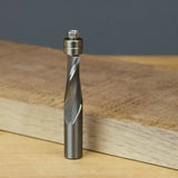 Carbide spiral flush trim router bit with bearing on wood surface for woodworking