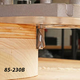 Close-up of a router bit cutting wood, woodworking tool in action, labeled 85-230B.