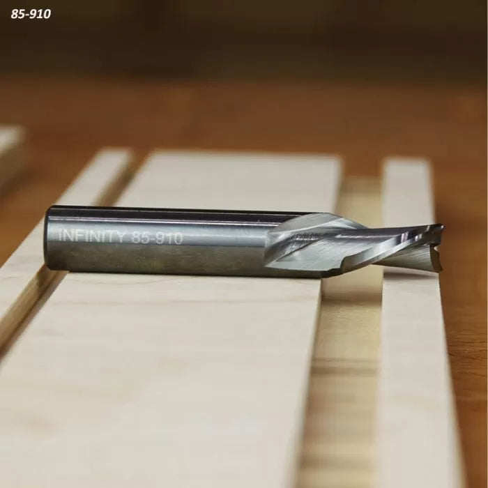 Solid carbide spiral router bit on wood surface, engraving 85-910 visible, woodworking tool
