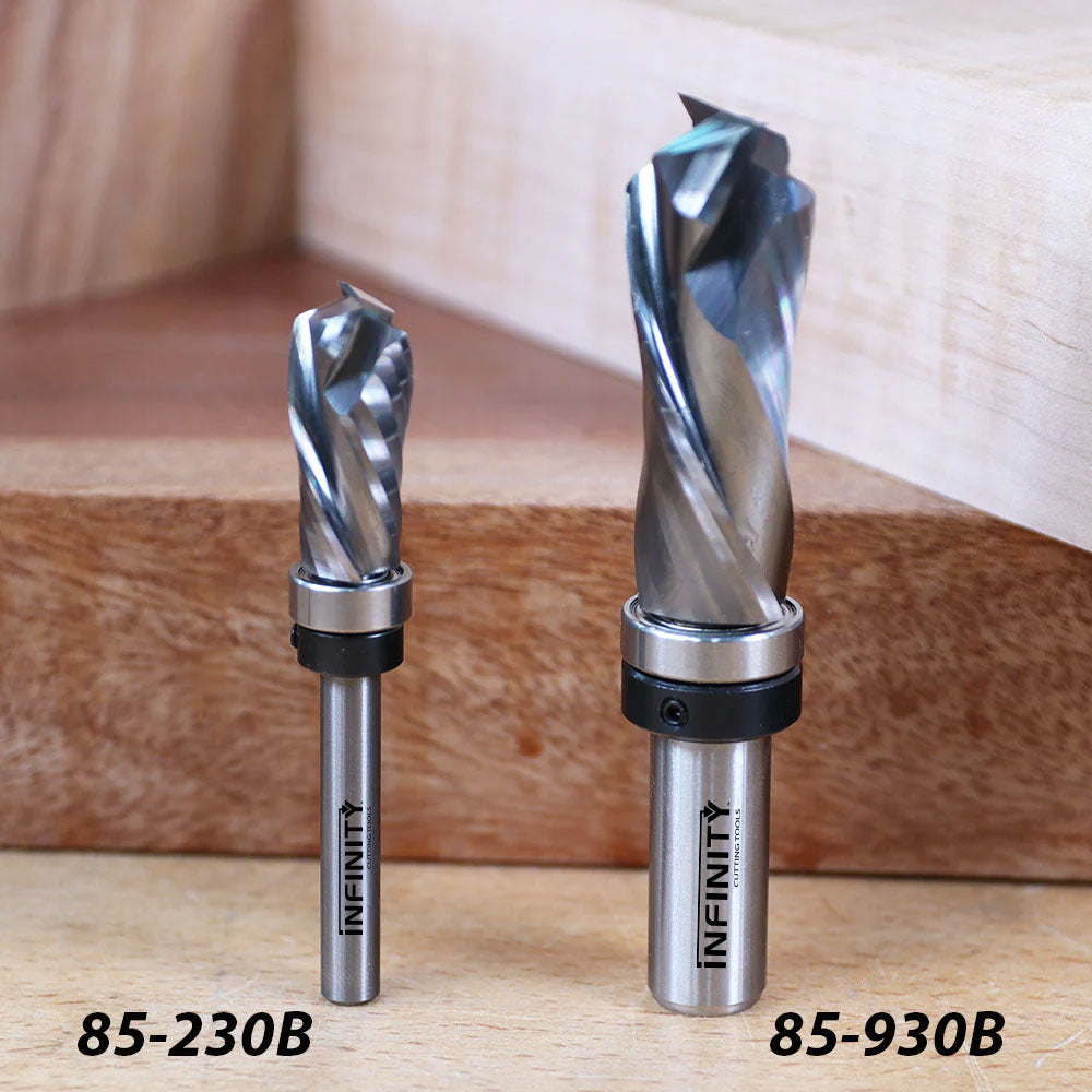 Two Infinity woodworking router bits, models 85-230B and 85-930B, on a wood surface.
