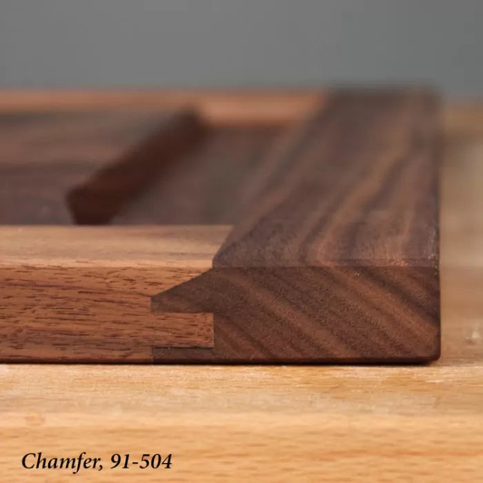 Close-up of a chamfered wooden joint on a woodworking project, showing precise joinery.