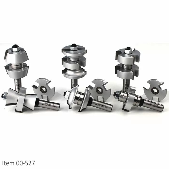 Set of carbide tipped router bits and slot cutters for woodworking on white background