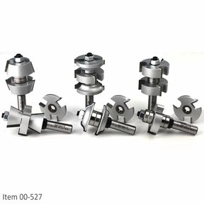 Set of carbide tipped router bits and slot cutters for woodworking on white background