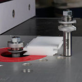 Slot cutting router bits with bearing guides on a router table for woodworking precision