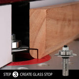 Router table cutting a glass stop profile in wood with a router bit, woodworking tool closeup.