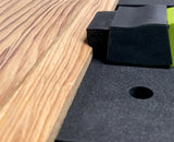 Bow clamp securing wood on a workbench for woodworking precision