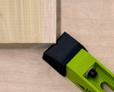 Bow clamp securing a wooden board on a workbench for woodworking projects