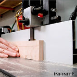 Band saw cutting wood with precision fence, woodworking tools in workshop setting