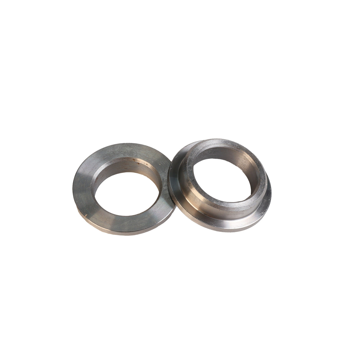 Pair of metal router table flange bushings for woodworking tools on white background
