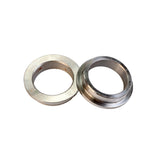 Two metal saw blade bushings for woodworking tools on a white background