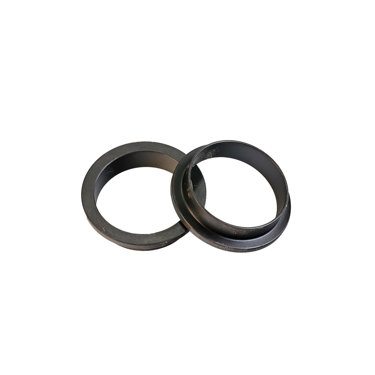 Two black plastic router table insert rings for woodworking dust collection