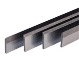 Set of four steel jointer knives for woodworking, aligned side by side on white background
