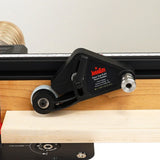 Close-up of JessEm Clear Cut FLEX stock guide mounted on a woodworking router table