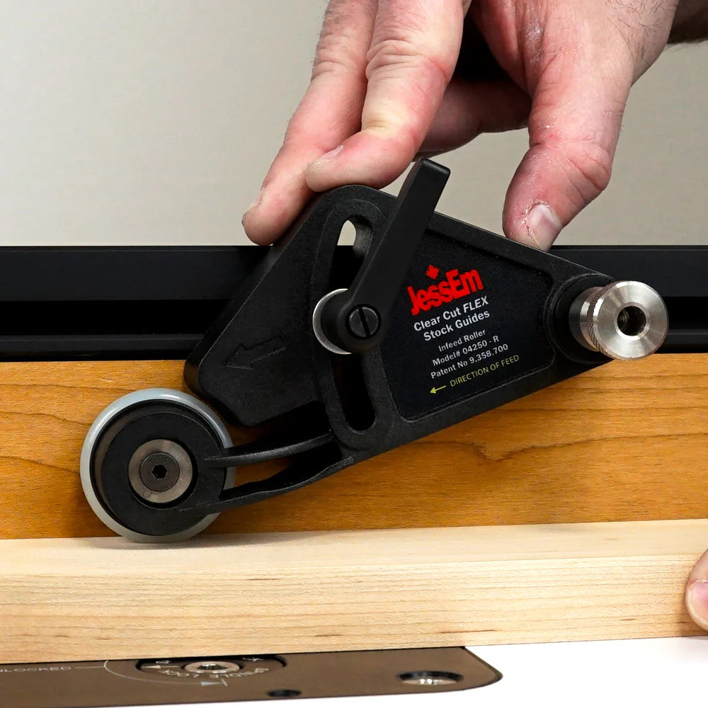 Router table stock guide applying pressure to wood for precise cutting