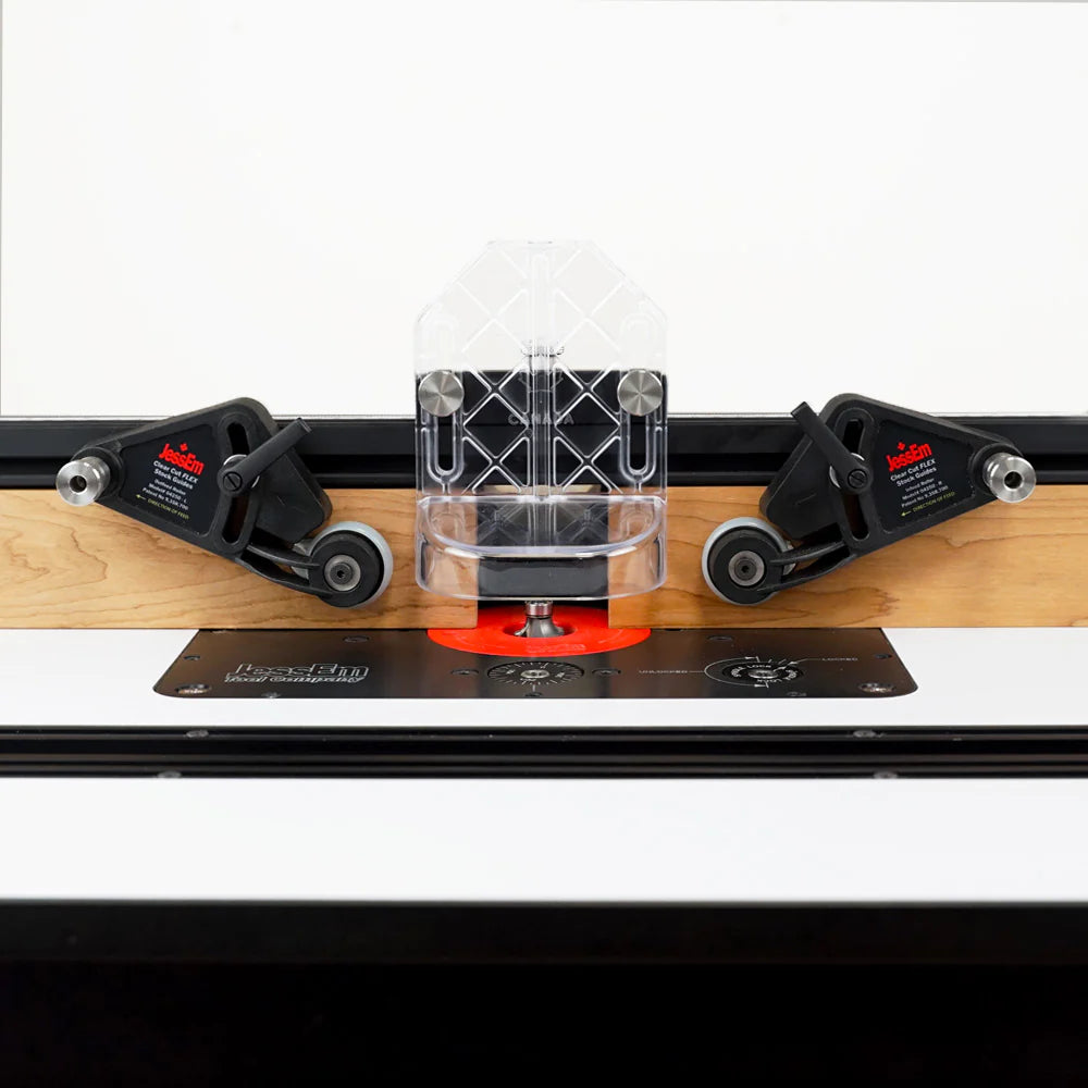 Router table with clear bit guard, dual feather boards, and visible router bit