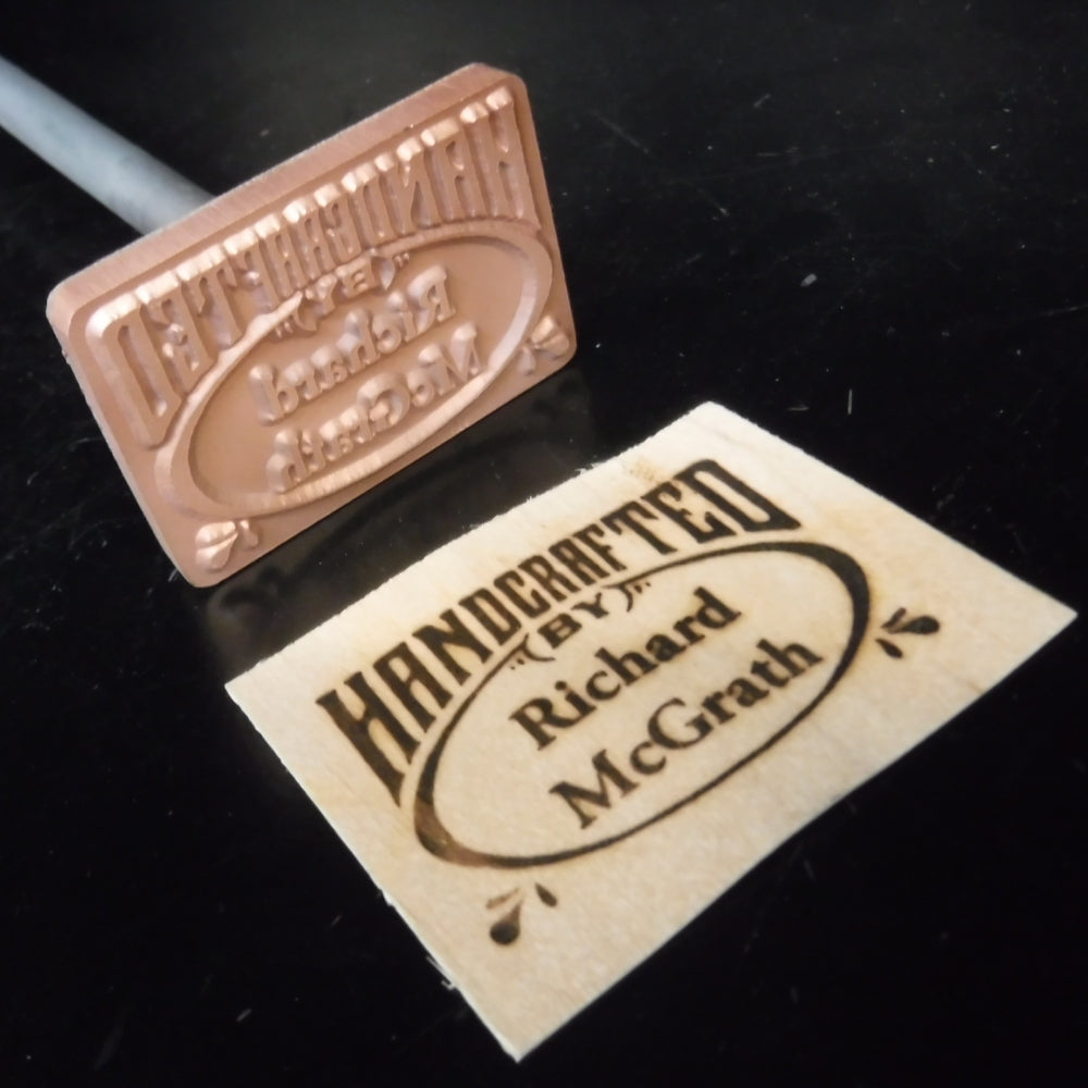 Custom wood branding iron with 'Handcrafted by Richard McGrath' engraved plate and label.