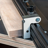 Easy Angle miter jig flip stop attached to a woodworking fence with a wood block