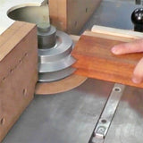 Woodworker using router table with stacked cutter head for precise wood shaping