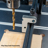 Drill press with flip stop fence for woodworking, flip stop accessory sold separately.