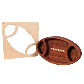Wooden football-shaped serving tray with routed template on white background