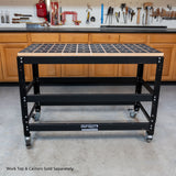 Black workbench with dog holes in a workshop setting