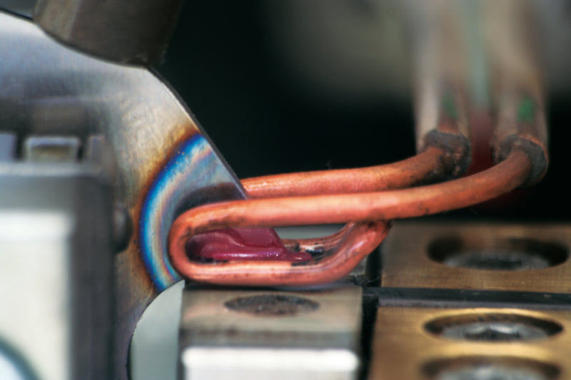 Close-up of carbide teeth being braised onto a saw body.