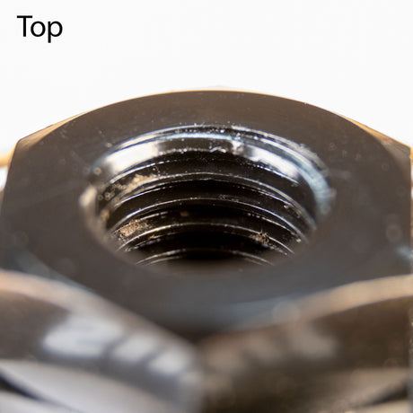 Close-up of internal nut threads, showcasing metal fastener detail for woodworking tools.
