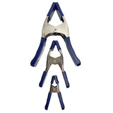 Set of three metal spring clamps with blue handles for woodworking projects