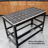 Heavy-duty woodworking workbench with grid-patterned tabletop and metal frame on casters