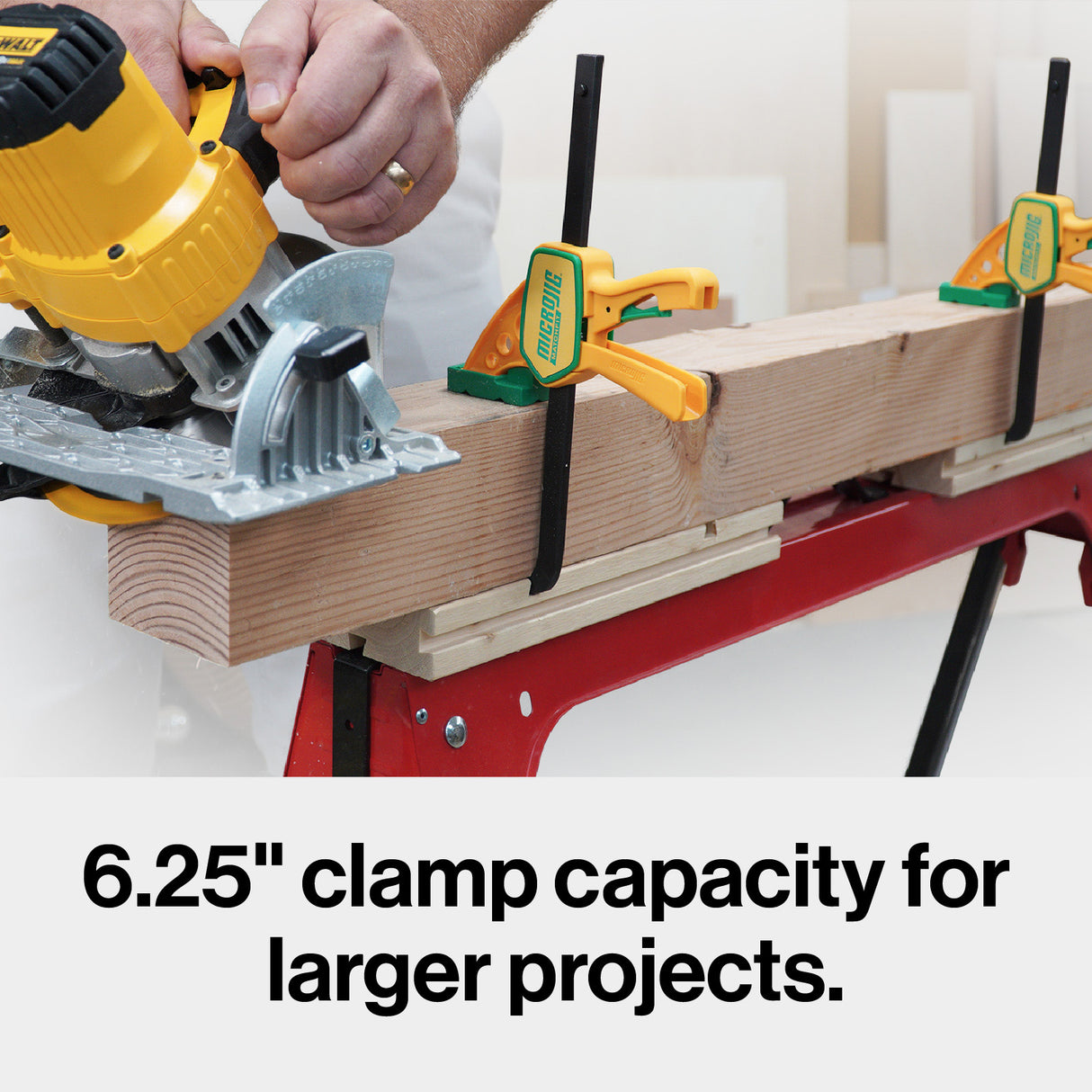 Quick-release woodworking clamps securing a large board on a workbench with a circular saw in use.