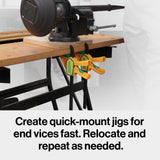 Workbench with vise and two quick-mount woodworking clamps attached underneath.