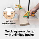 Hand using quick squeeze clamp on wooden board with 1/2 x 14° dovetail groove for woodworking.