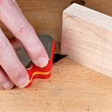 Woodworker using marking knife to scribe accurate line on hardwood surface