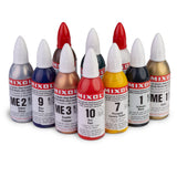 Assorted Mixol universal tinting colorant bottles in various colors on white background