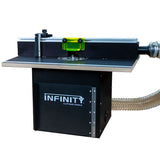 Router table with fence, dust collection hose, and clear safety guard for woodworking.