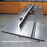 Cast iron router table with fence, ruler, and optional extension wings in workshop setting
