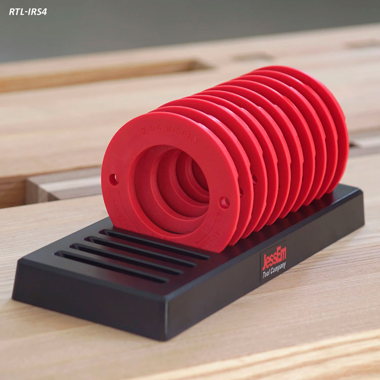 Router table insert ring set with red rings on black holder, woodworking accessory