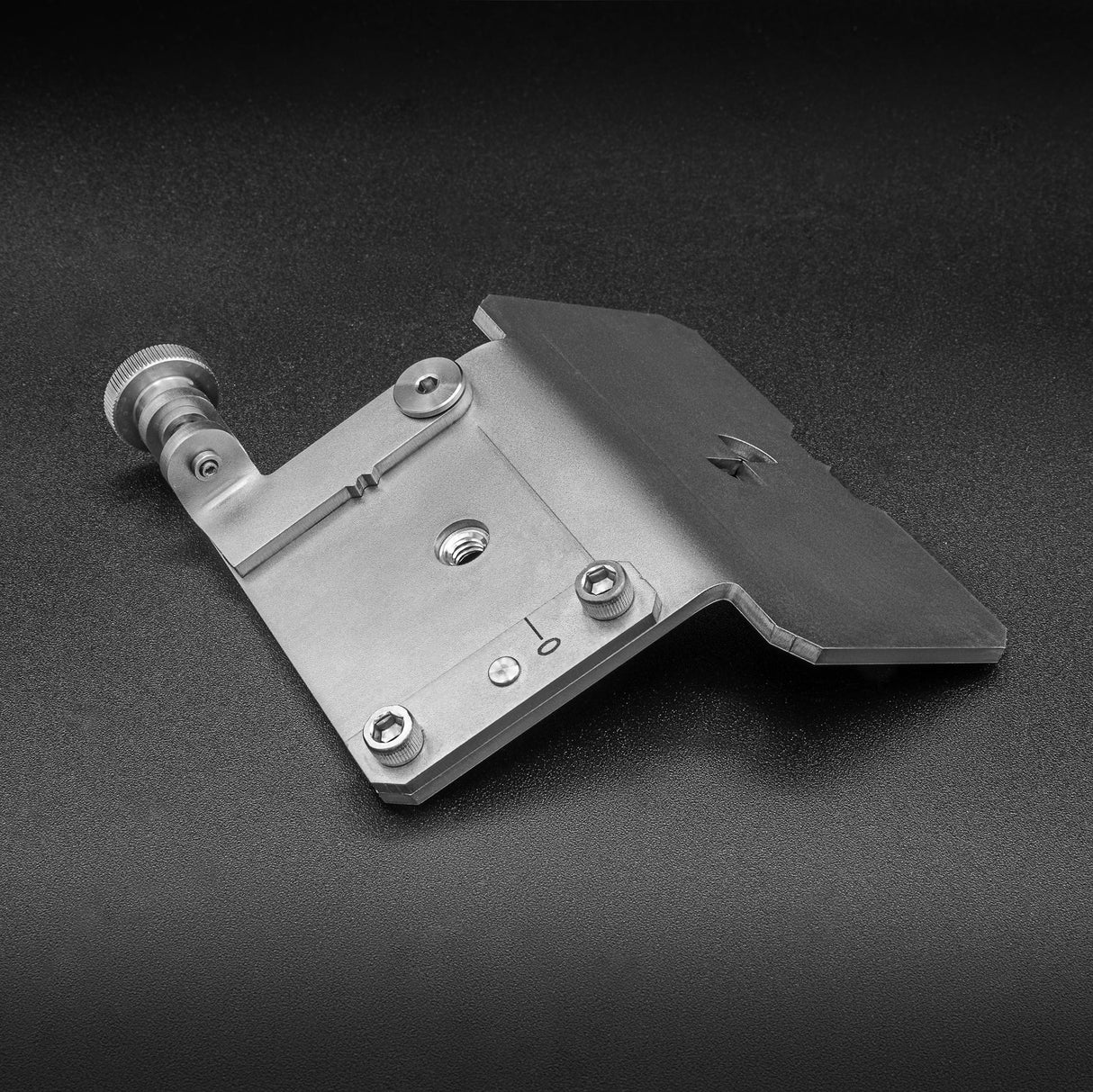 Adjustable metal miter gauge jig for woodworking, precision tool on a black surface